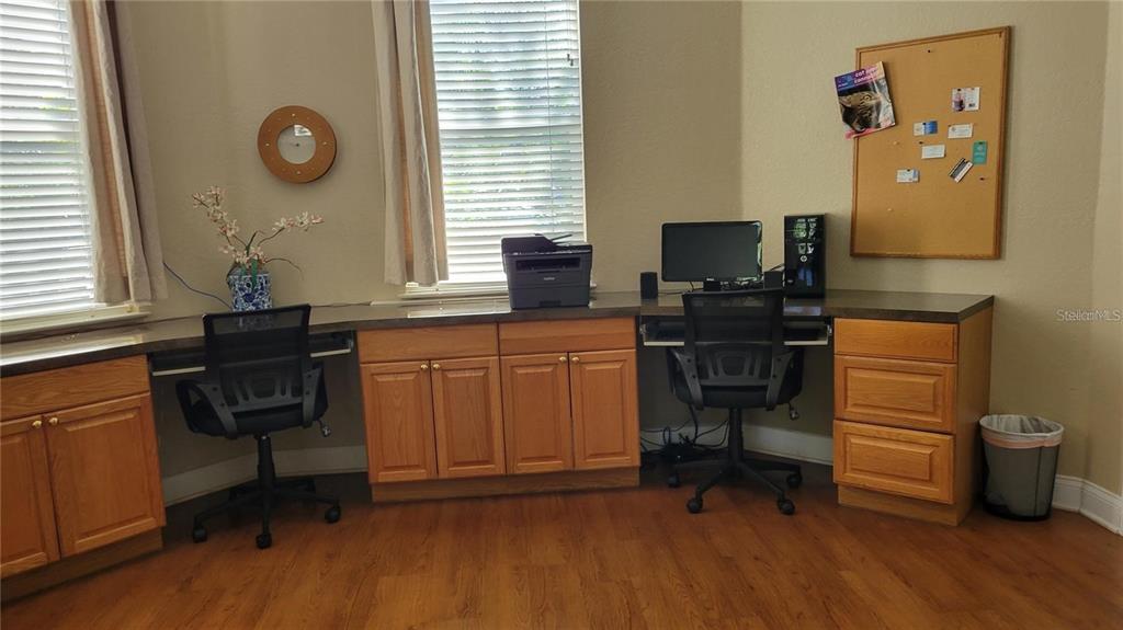 5168 Northridge Road, Unit 106 Sarasota, FL 34238 - Photo 24 of 33 a view of workspace with wooden floor windows