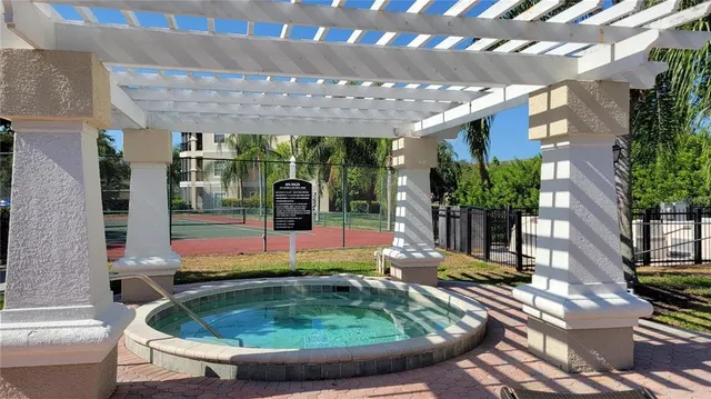a view of a swimming pool with a patio