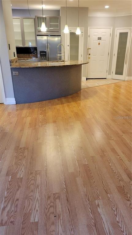 5168 Northridge Road, Unit 106 Sarasota, FL 34238 - Photo 8 of 33 a view of a kitchen with stainless steel appliances granite countertop a sink and a stove