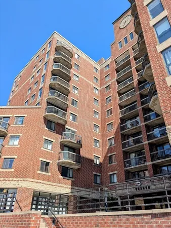 a front view of a building with garden