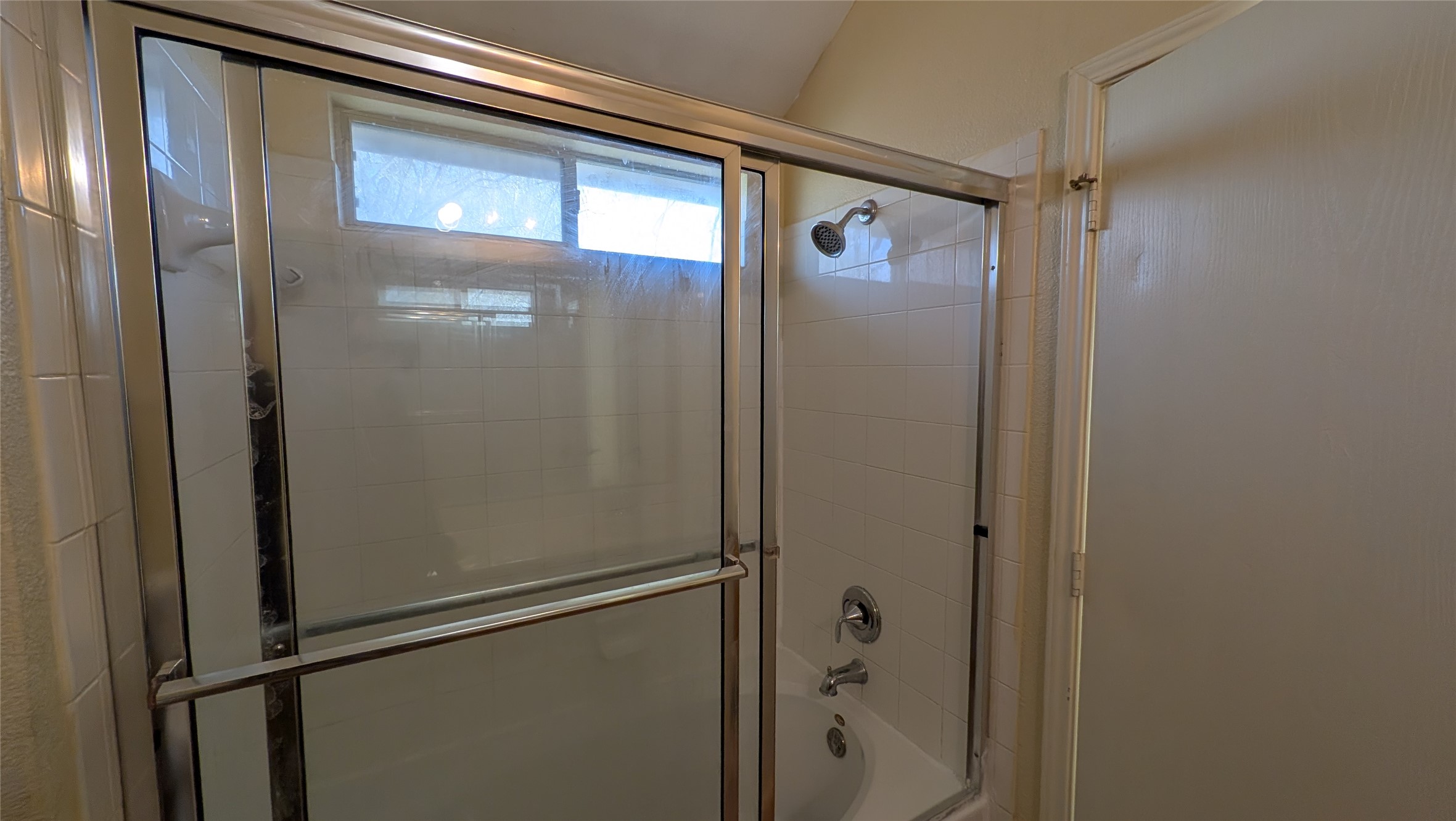 8525 Chick Pea Lane Austin, TX 78745 - Photo 17 of 22 Full bath with shower / bath combination with glass door