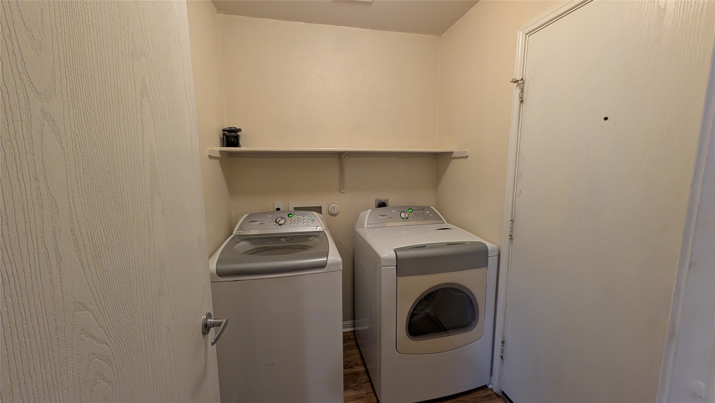 8525 Chick Pea Lane Austin, TX 78745 - Photo 7 of 22 Laundry room featuring independent washer and dryer and dark wood-style floors