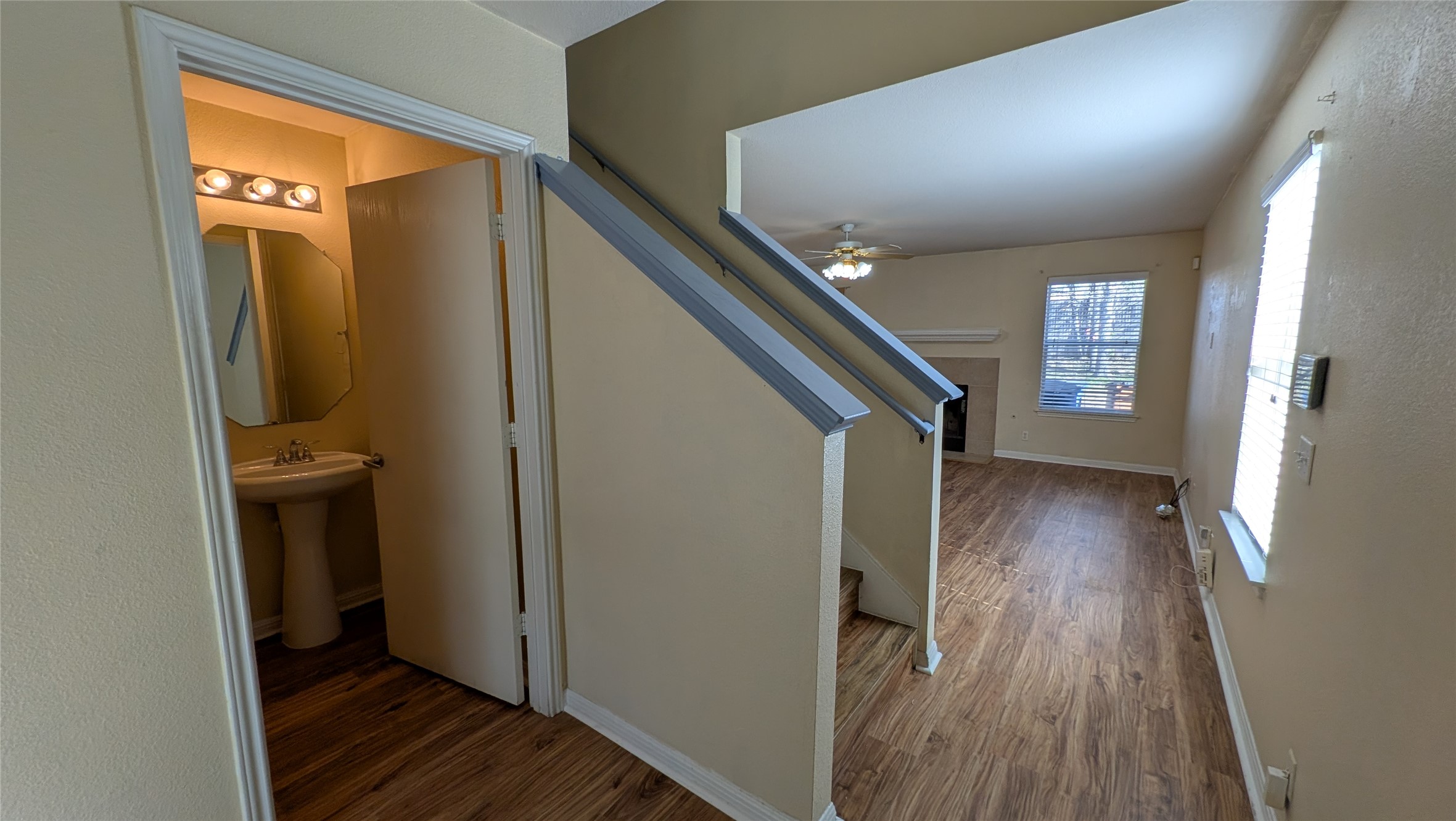 8525 Chick Pea Lane Austin, TX 78745 - Photo 9 of 22 Staircase featuring wood finished floors and ceiling fan