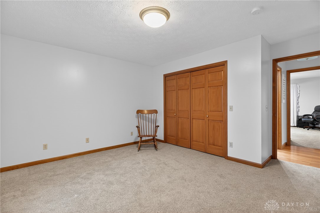 5264 Frazier-Guy Road Sidney, OH 45365 - Photo 31 of 51 This spacious bedroom offers ample natural light, creating a bright and inviting atmosphere.