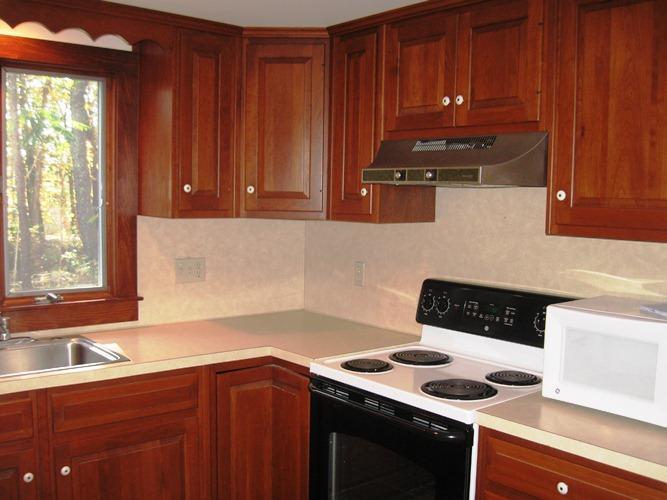 45 Boreen Road Eastham, MA 02642 - Photo 13 of 22 a kitchen with a sink cabinets and a stove top oven