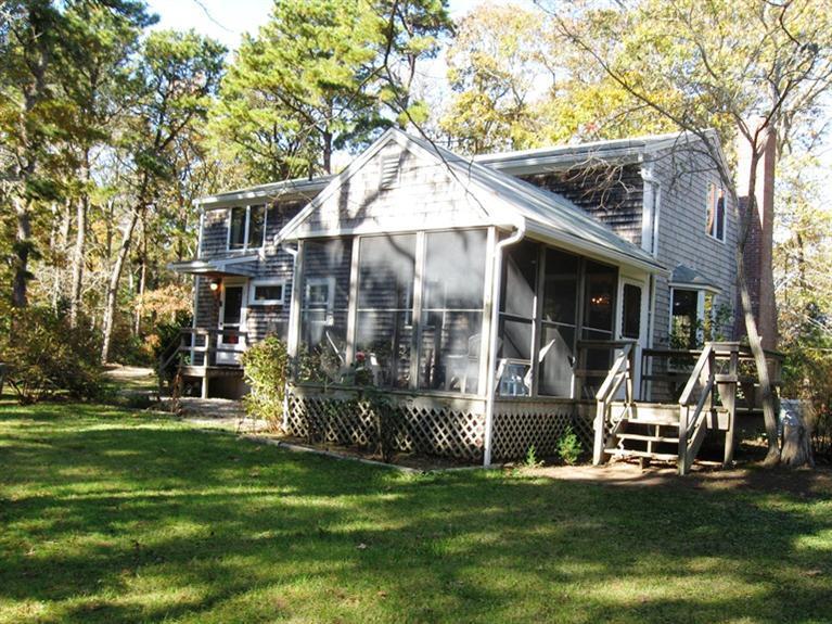 45 Boreen Road Eastham, MA 02642 - Photo 4 of 22 a front view of a house with a garden