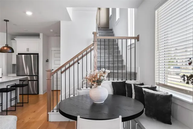 a kitchen with kitchen island granite countertop a sink a stove and cabinets