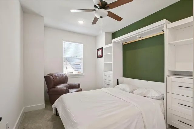 a bathroom with double vanity sinks and a mirror