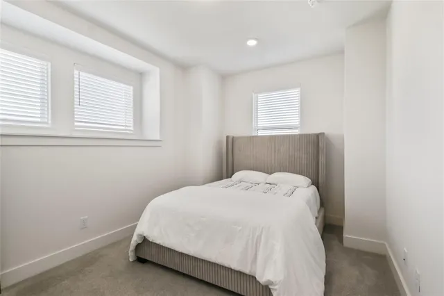 a living room with furniture and a ceiling fan
