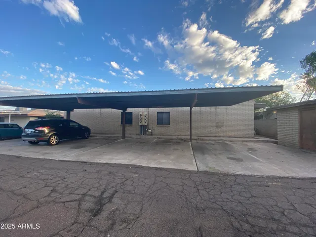 a view of a parking space in back of a building