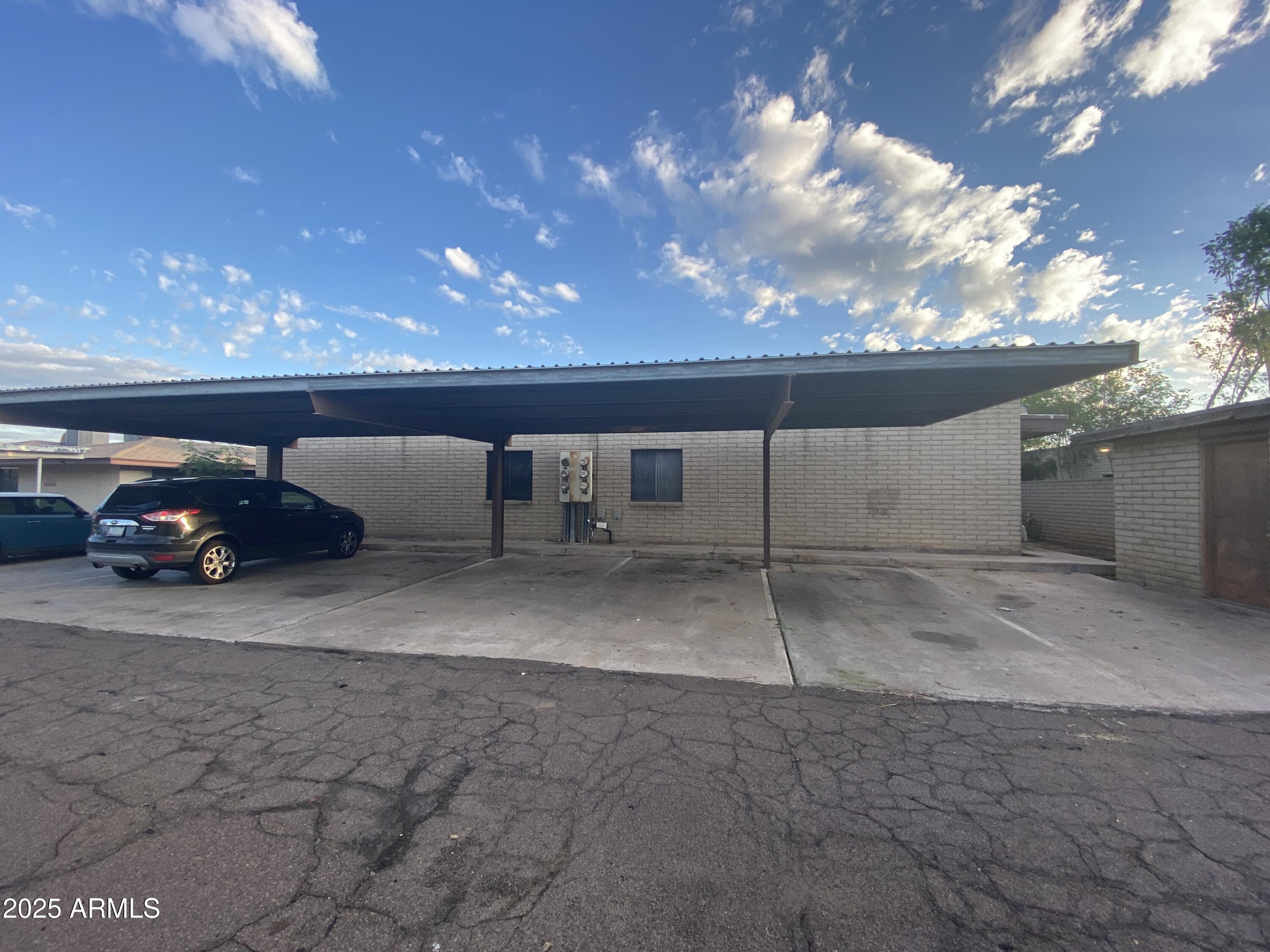416 West Pebble Beach Drive Tempe, AZ 85282 - Photo 1 of 7 a view of a parking space in back of a building