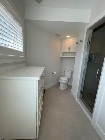a view of a storage & utility room with a sink