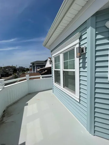 a kitchen with stainless steel appliances kitchen island granite countertop a stove a sink and a microwave