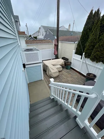 a view of balcony with wooden floor