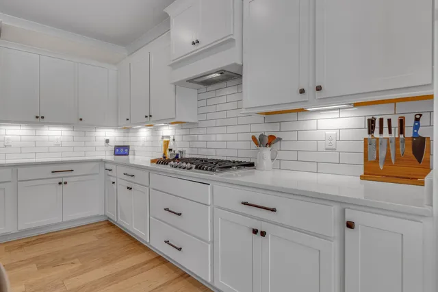 a bedroom with a bed and a stove