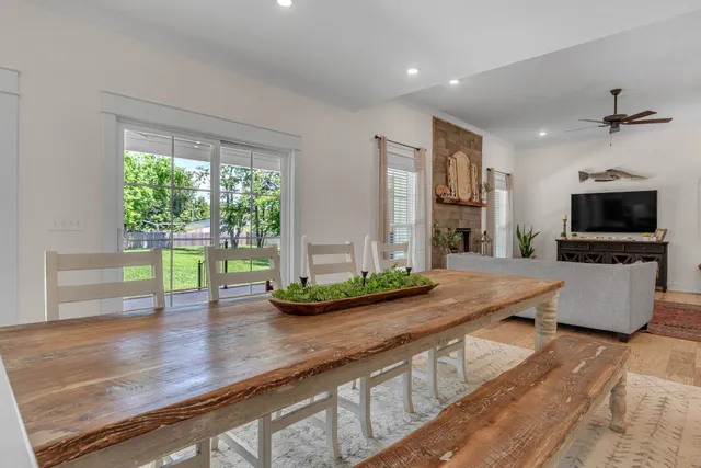 a spacious bathroom with a double vanity sink mirror and shower