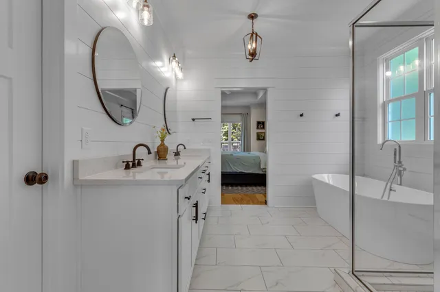 a bedroom with furniture and a wooden floor