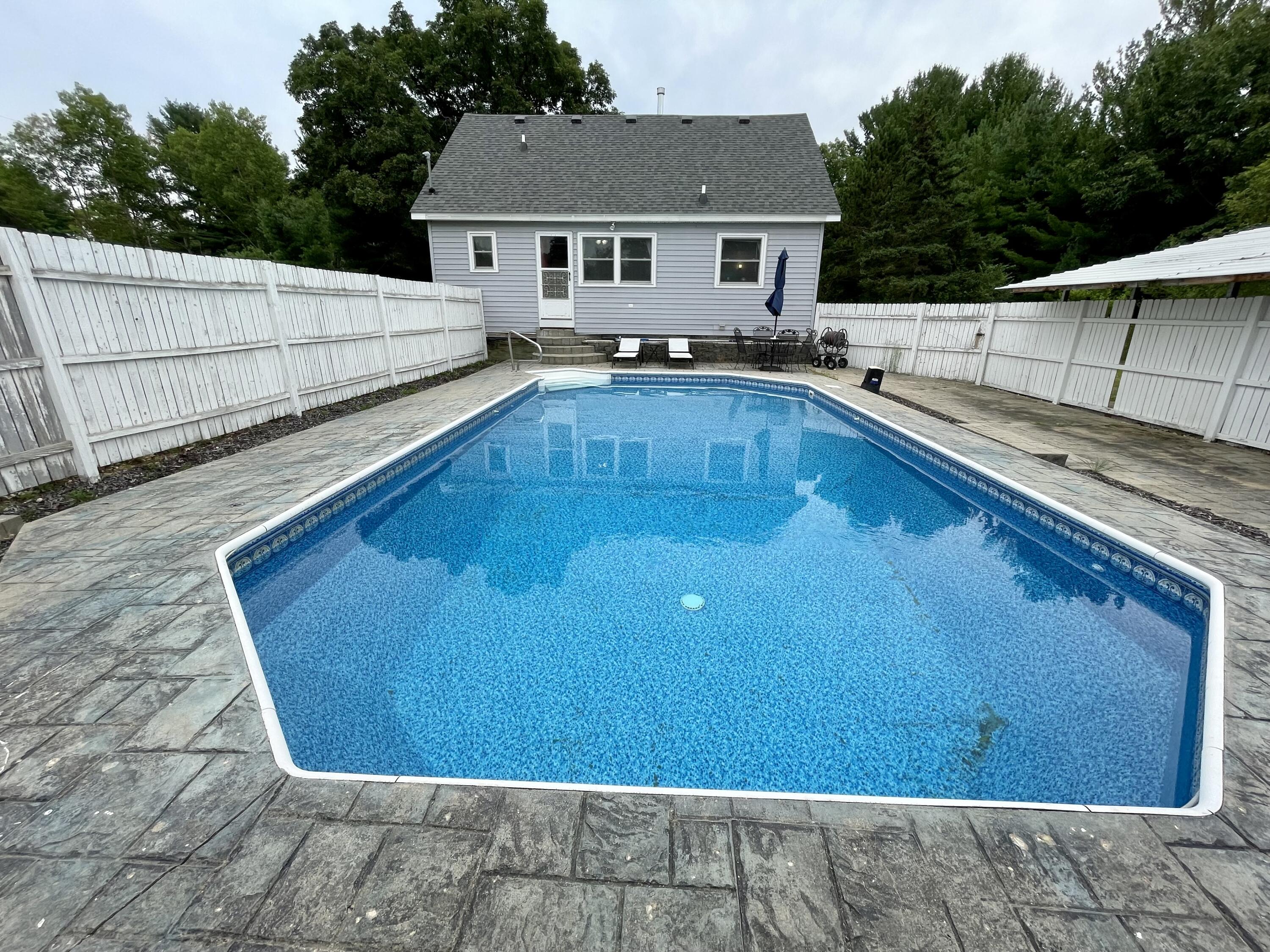 1871 North Littlefield Road Weidman, MI 48893 - Photo 3 of 22 #3 Pool:Back of home