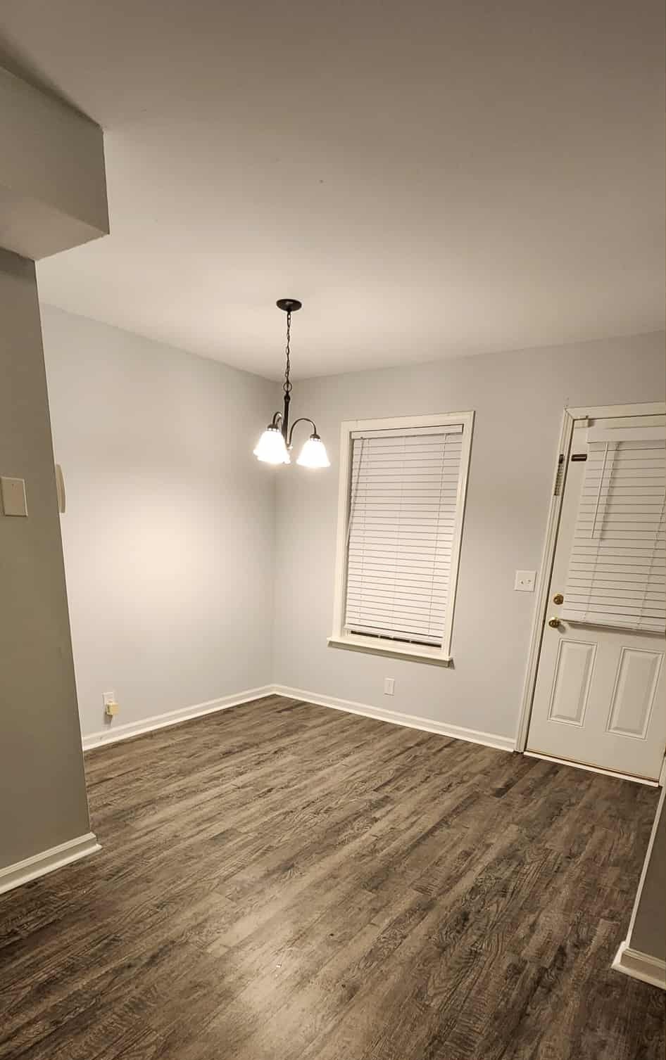 289 Raleigh Drive, Unit B Clarksville, TN 37043 - Photo 7 of 22 an empty room with wooden floor fan and window