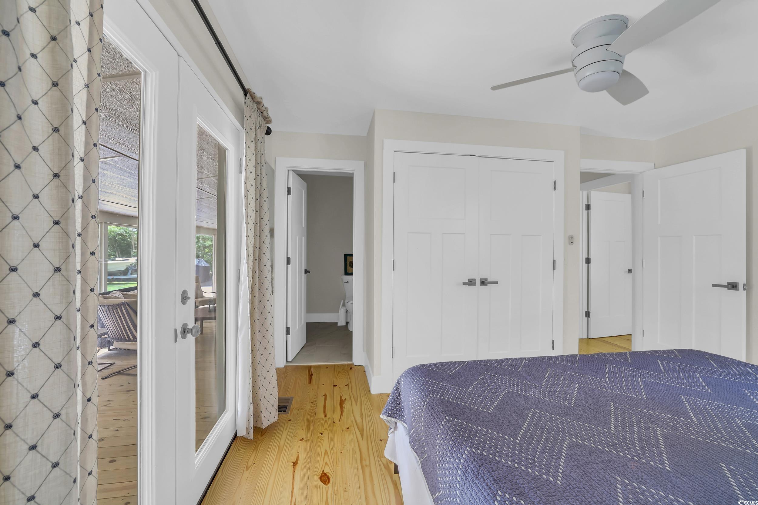 485 County Rd S-22-592 Georgetown, SC 29440 - Photo 20 of 40 Bedroom featuring light wood finished floors, a closet, and a ceiling fan
