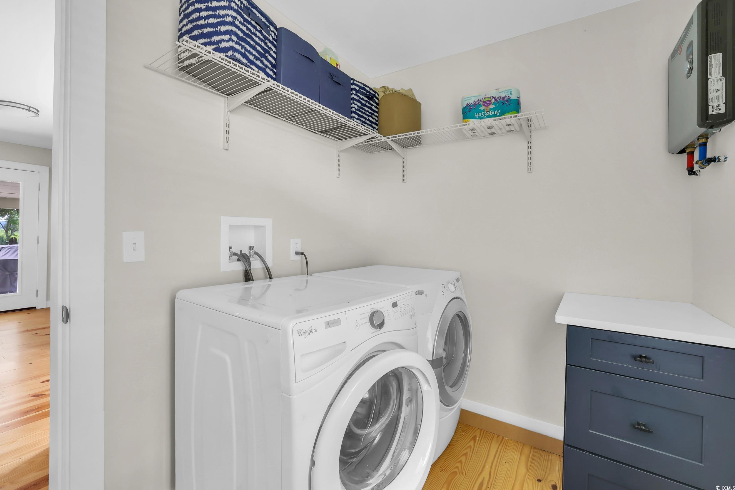 485 County Rd S-22-592 Georgetown, SC 29440 - Photo 22 of 40 Laundry room with light wood-style flooring and washer and dryer