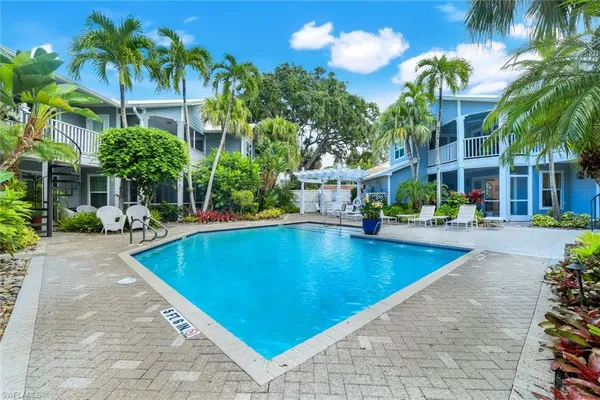 a view of a swimming pool with a patio