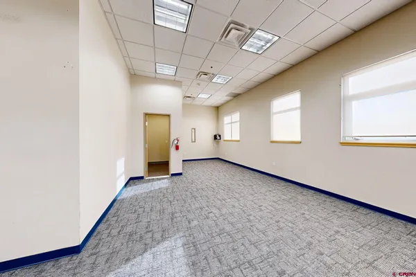 a bathroom with a glass shower door and a sink