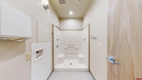 a front view of a house with a garden and street view