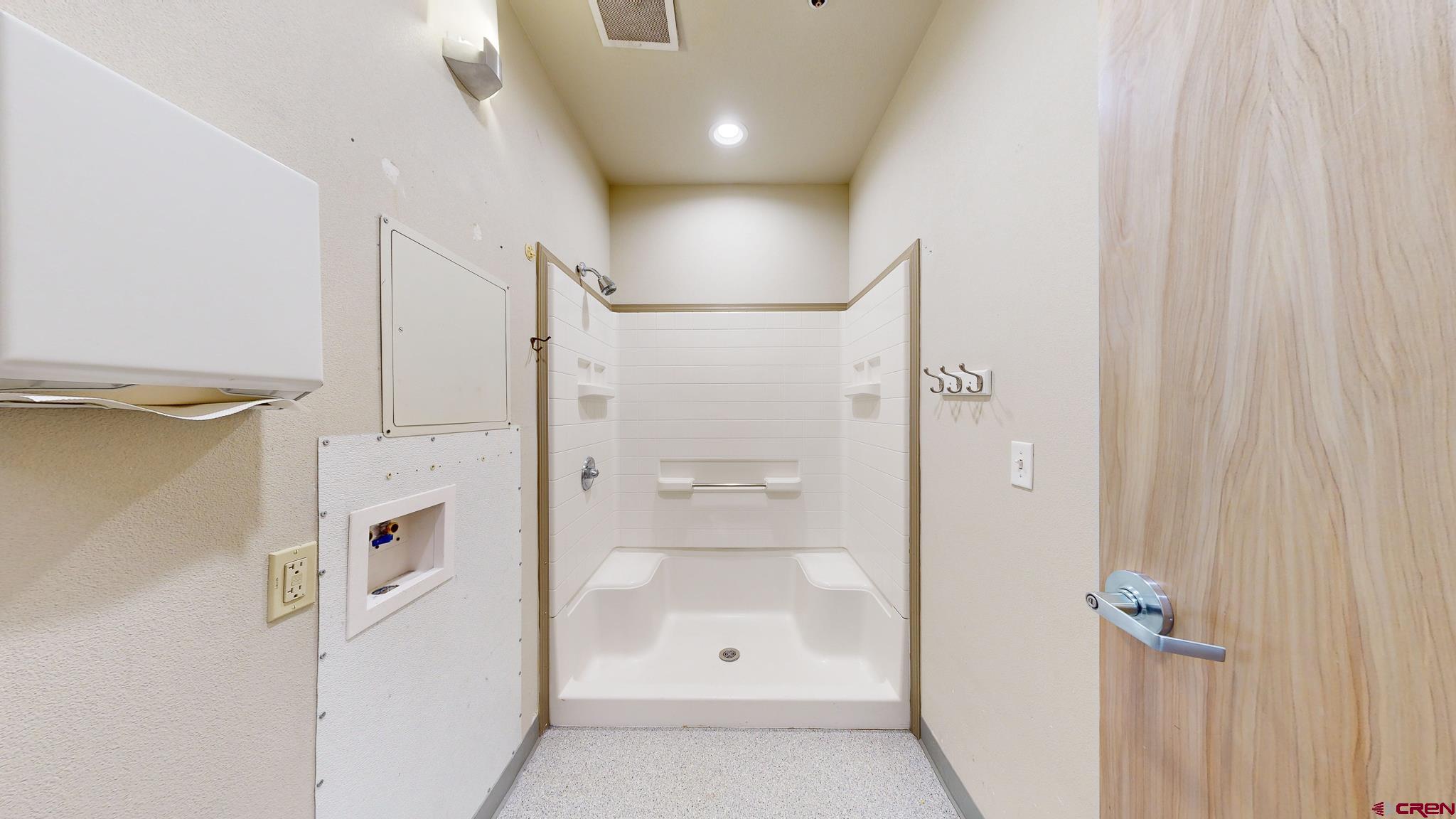 575 Rivergate Lane, Unit 208 Durango, CO 81301 - Photo 13 of 22 a bathroom with a glass shower door and a sink