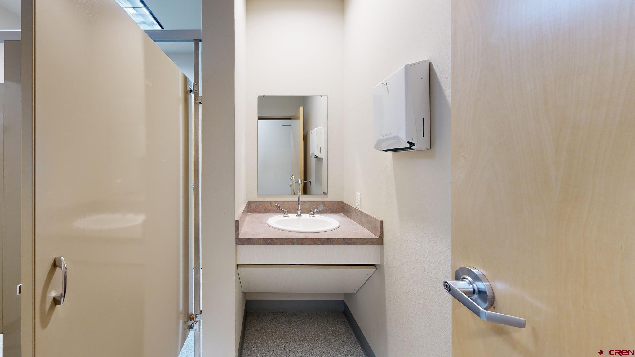 575 Rivergate Lane, Unit 208 Durango, CO 81301 - Photo 14 of 22 a bathroom with a sink and a mirror