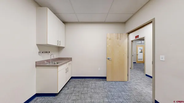 a view of a room with a sink and dishwasher