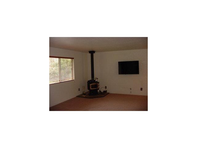 833 Lewis Road Watsonville, CA 95076 - Photo 8 of 9 a living room with a couch and a flat screen tv