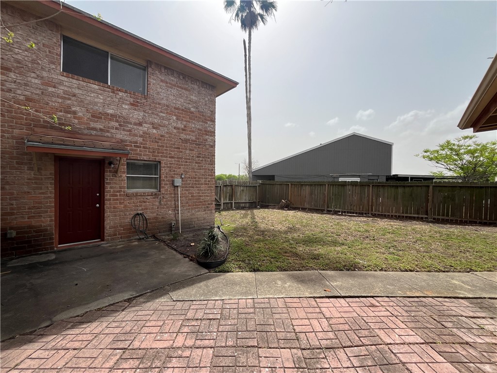 6533 Long Meadow Drive, Unit A Corpus Christi, TX 78413 - Photo 19 of 21 a front view of a house with yard