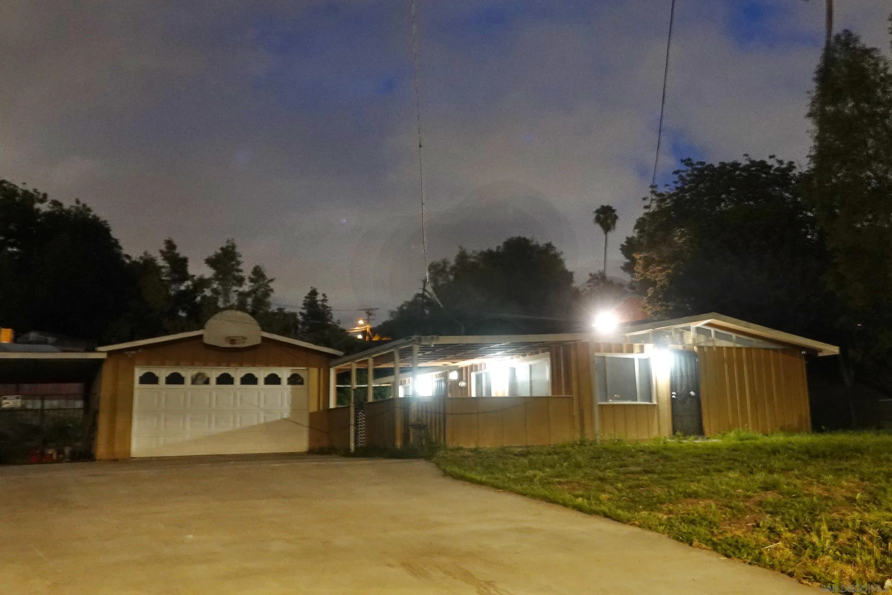 10088 Campo Road Spring Valley, CA 91977 - Photo 1 of 14 a big room with lots of trees in the background