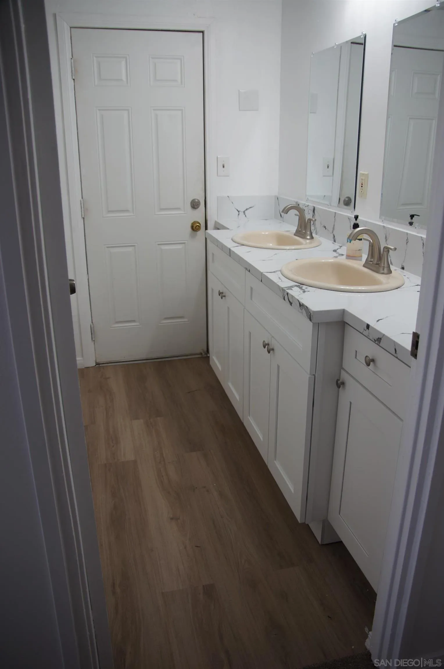 10088 Campo Road Spring Valley, CA 91977 - Photo 12 of 14 a bathroom with a sink and a mirror