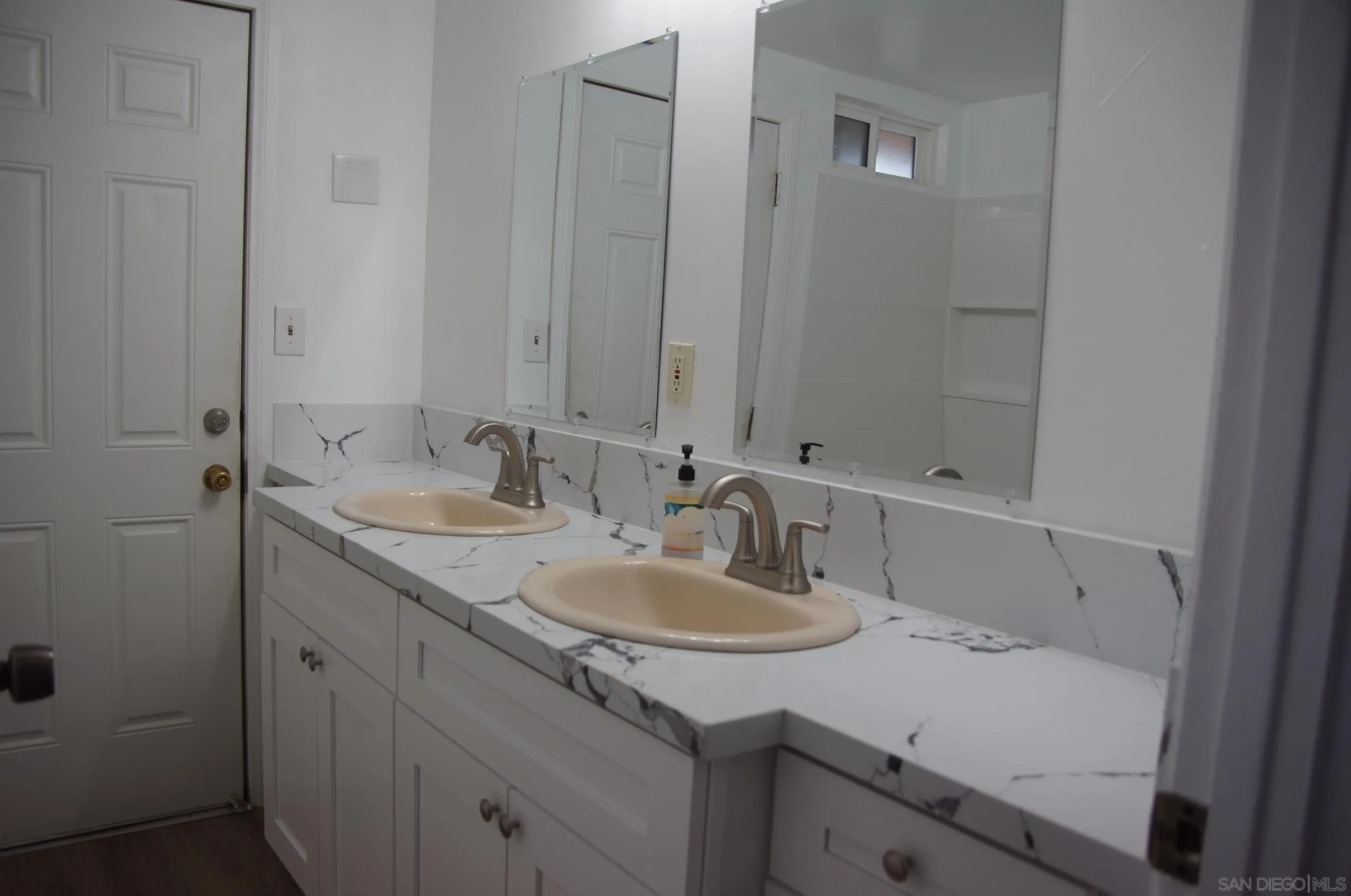 10088 Campo Road Spring Valley, CA 91977 - Photo 10 of 14 a bathroom with a sink and a mirror