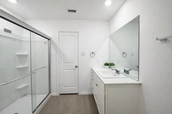a bathroom with a sink and mirror