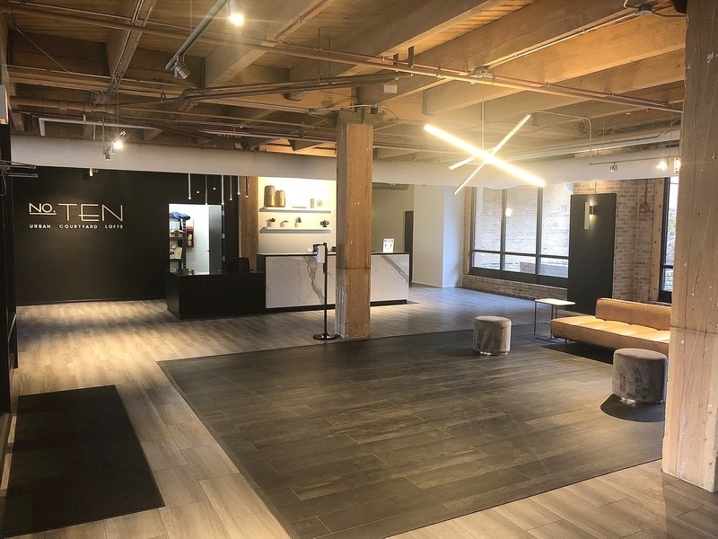 1040 West Adams Street, Unit 239 Chicago, IL 60607 - Photo 11 of 12 a lobby with furniture and a rug
