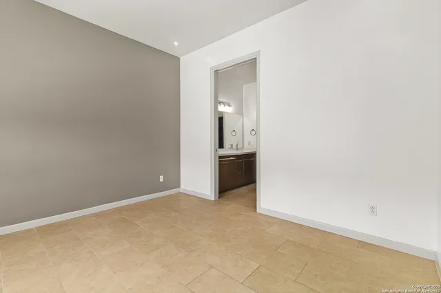 an empty room with a bathroom