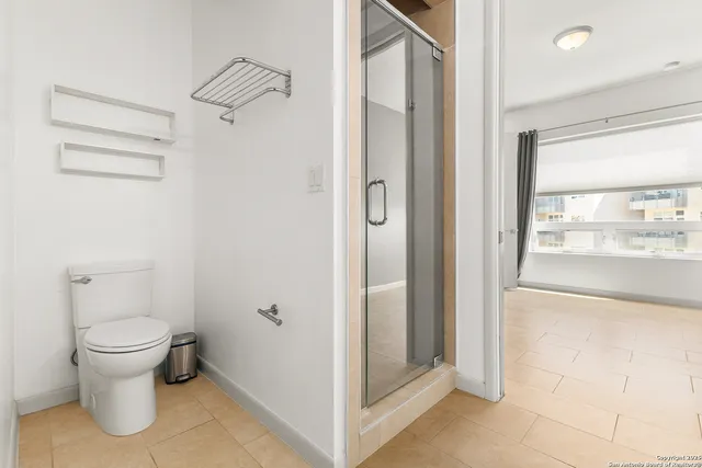 a view of bathroom and toilet