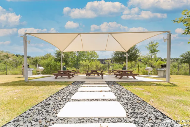 a view of a swimming pool with a lounge chairs