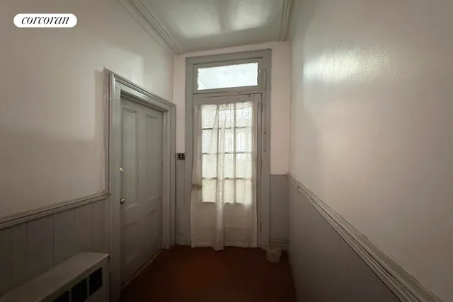 a view of living room kitchen and windows
