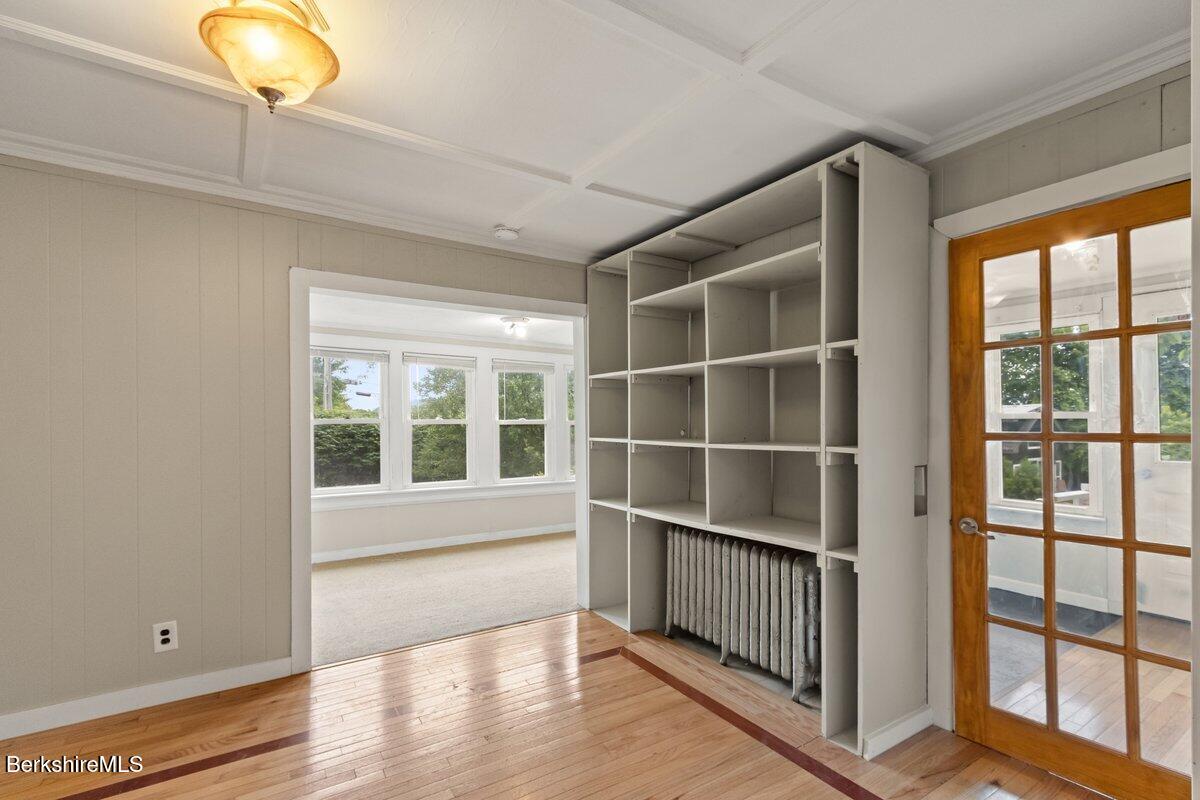 97 Barth Street North Adams, MA 01247 - Photo 14 of 31 a view of an empty room with wooden floor and a window