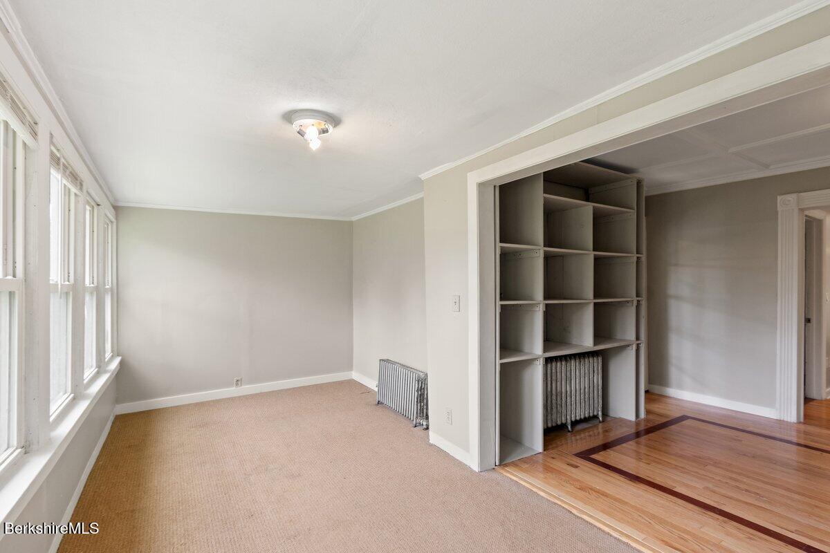 97 Barth Street North Adams, MA 01247 - Photo 17 of 31 a view of an empty room with wooden floor and a window