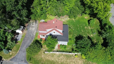 an aerial view of house with yard