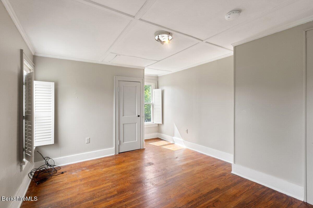 97 Barth Street North Adams, MA 01247 - Photo 25 of 31 an empty room with wooden floor and windows