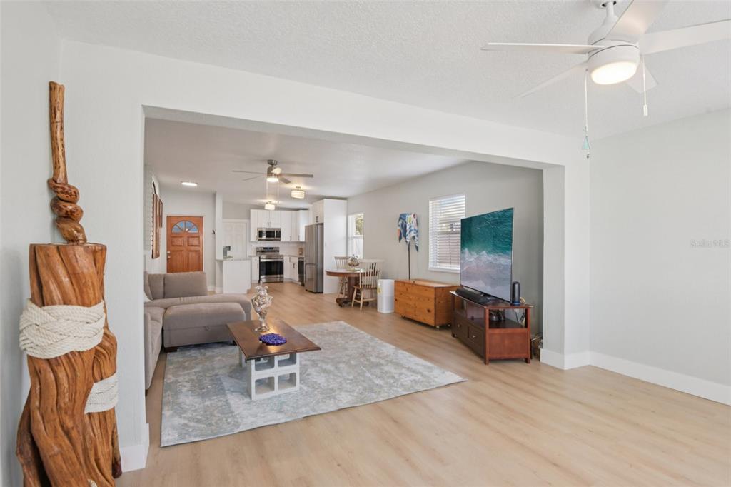 204 160th Avenue Redington Beach, FL 33708 - Photo 12 of 32 a living room with furniture and a flat screen tv