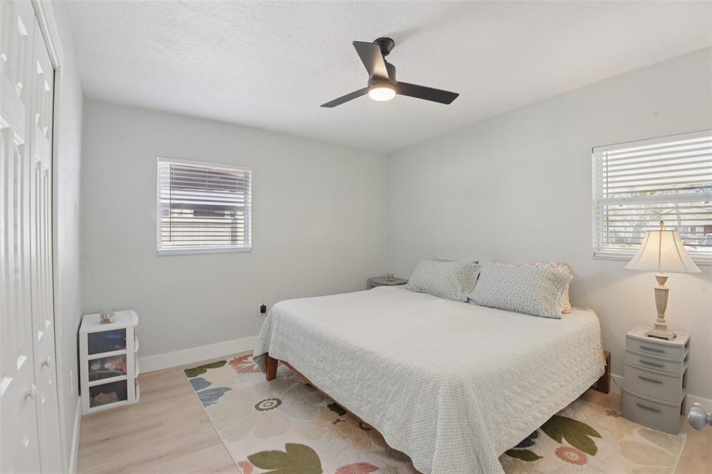 204 160th Avenue Redington Beach, FL 33708 - Photo 13 of 32 a bedroom with a bed and a window