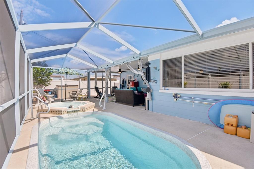 204 160th Avenue Redington Beach, FL 33708 - Photo 21 of 32 a bedroom with furniture and a large window