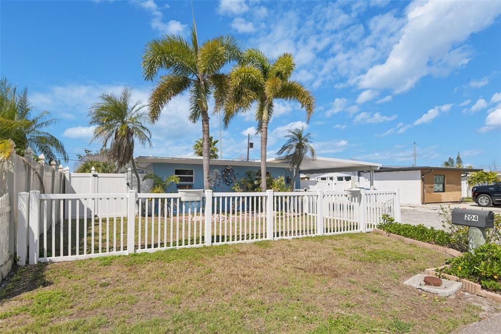 204 160th Avenue Redington Beach, FL 33708 - Photo 30 of 32 a view of a house with a small yard and plants